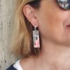 Orecchini pendenti di perline con volto di donna