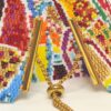 Bracciale a fascia alta di perline con chiusura regolabile design astratto colori caldi