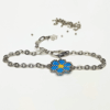 Bracciale margherita blu con catena in acciaio e charm in argento 925