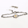 Bracciale margherita con catena in acciaio e charm in argento 925