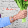 Bracciali margherite di perline fatte a mano con catena in acciaio indossati